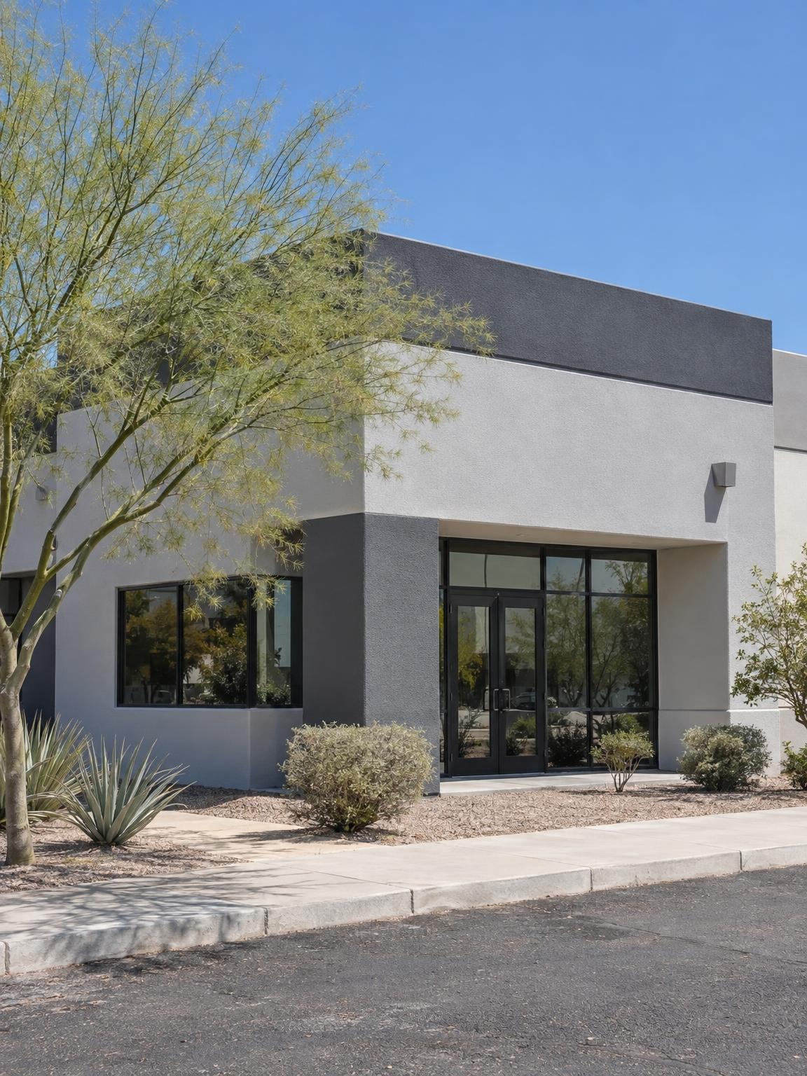 Small office building painted grey and charcoal